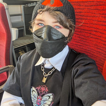 Picture of Jay A photo of Jay on the train wearing alternative fashion, goth and punk inspired.